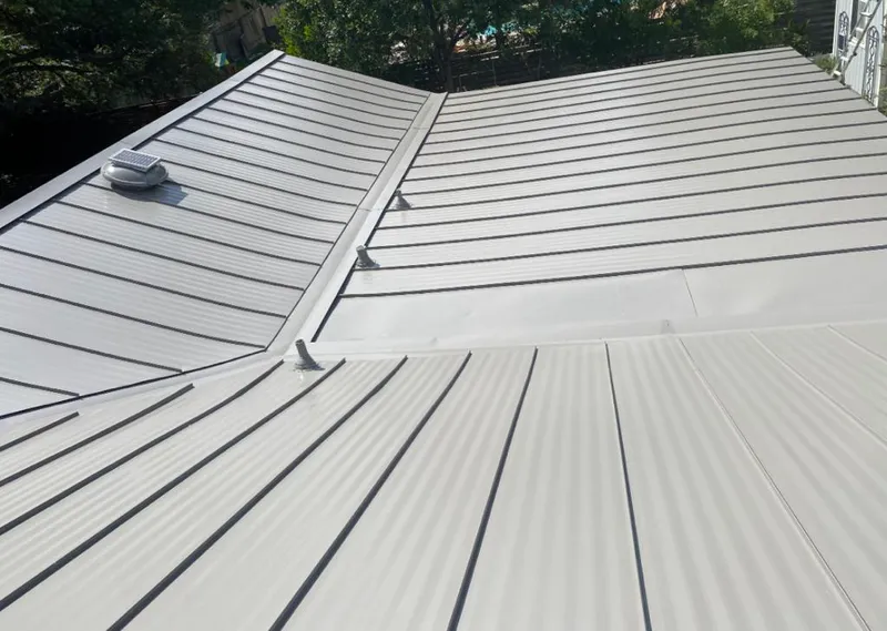 Solar attic fan installed on a metal roof for Roof Ventilation in Lake Tapps